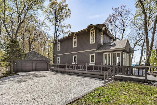 47130 Blue Star Hwy, Covert, MI 49043 - back of property with a wooden deck, a detached garage, and an outdoor structure