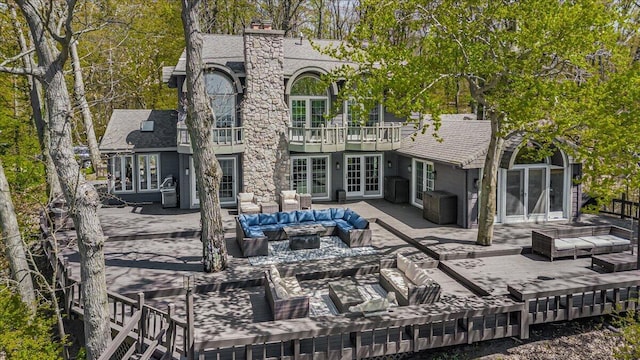 47130 Blue Star Hwy, Covert, MI 49043 - rear view of property with an outdoor hangout area, french doors, a chimney, and a balcony