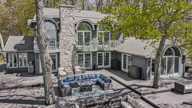 47130 Blue Star Hwy, Covert, MI 49043 - rear view of house featuring outdoor lounge area, french doors, a deck, and a chimney