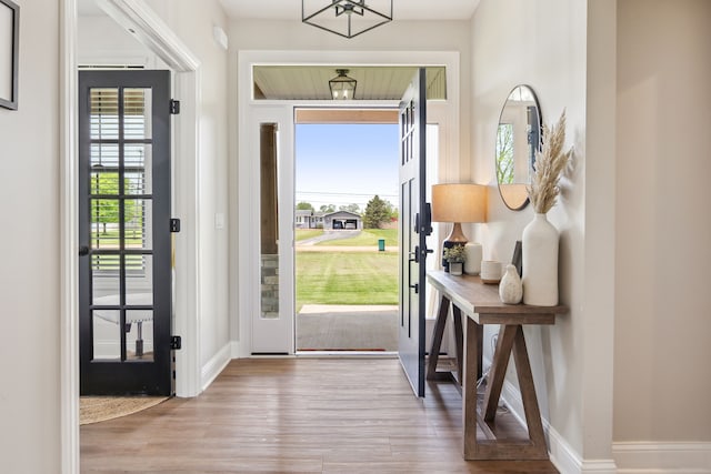 entrance foyer featuring wood finished floors and baseboards