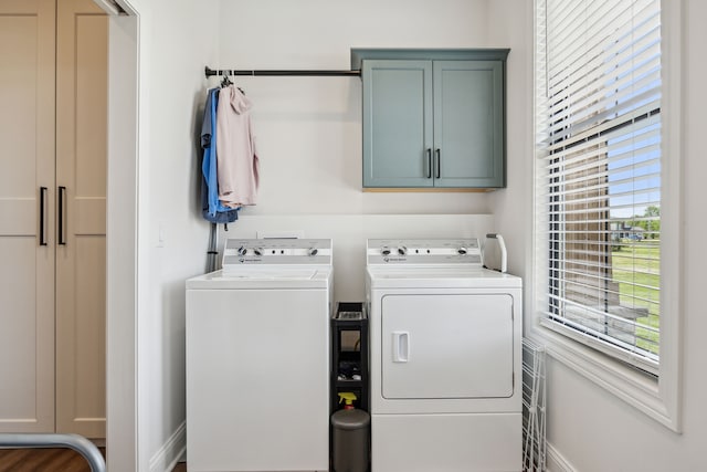 laundry area featuring cabinet space and washer and clothes dryer