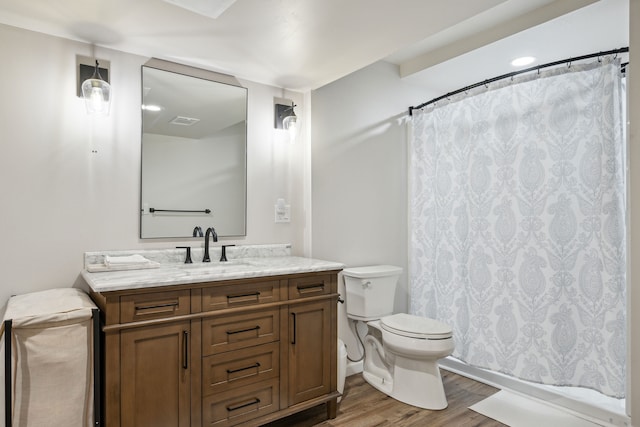 full bath with wood finished floors, toilet, vanity, and a shower with shower curtain