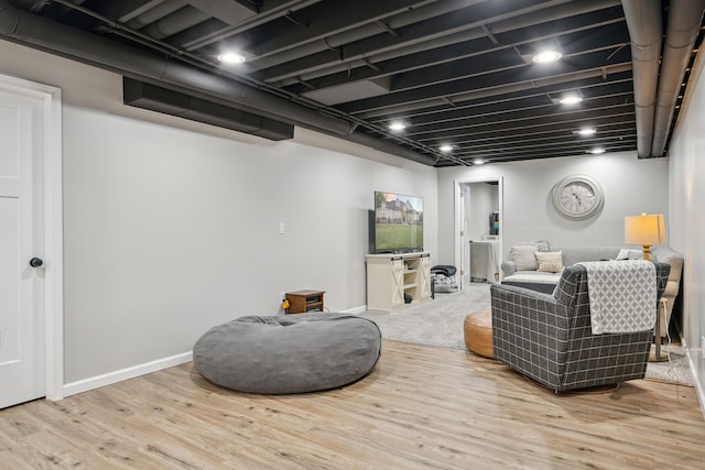 living room with wood finished floors and baseboards