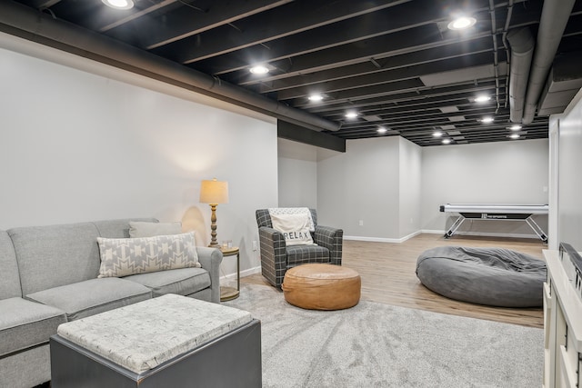 living room with wood finished floors and baseboards