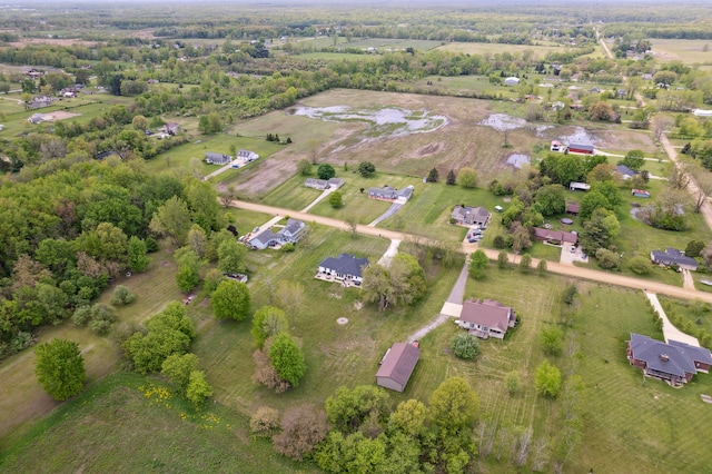 aerial view of property and surrounding area featuring rural landscape