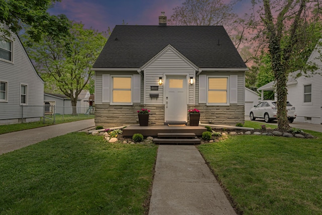 view of front facade featuring stone siding, a chimney, and roof with shingles