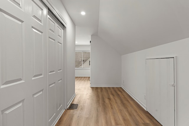 bonus room with wood finished floors, baseboards, lofted ceiling, and recessed lighting