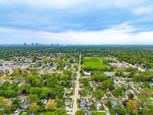aerial view of property and surrounding area with nearby suburban area