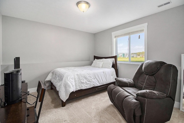 carpeted bedroom featuring baseboards