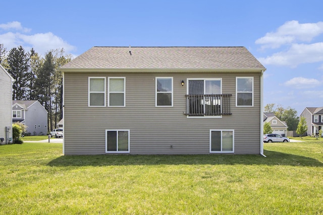 back of property with a yard