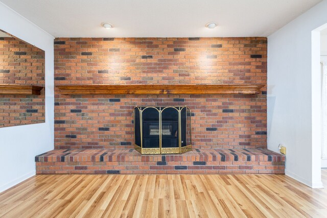 6934 Colonial Dr, Tecumseh, MI 49286 - unfurnished living room with wood finished floors and baseboards