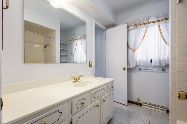 6934 Colonial Dr, Tecumseh, MI 49286 - bathroom featuring vanity, tile patterned floors, and a shower