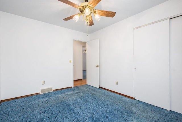 6934 Colonial Dr, Tecumseh, MI 49286 - unfurnished bedroom with carpet flooring, ceiling fan, a closet, and baseboards