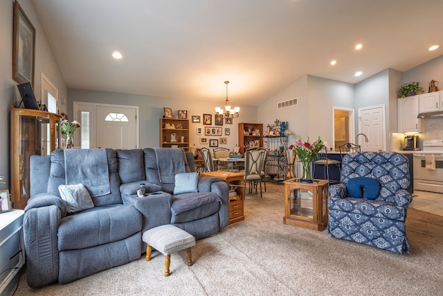 living area featuring a chandelier, light carpet, recessed lighting, and vaulted ceiling