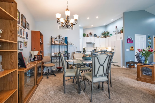 dining room with a chandelier, light carpet, high vaulted ceiling, and recessed lighting