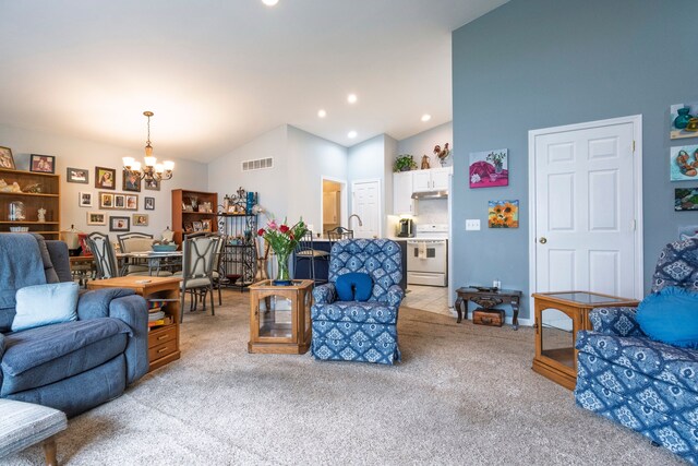 living area featuring a chandelier, light colored carpet, recessed lighting, and high vaulted ceiling
