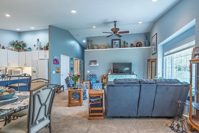 living room featuring light colored carpet, a ceiling fan, recessed lighting, and high vaulted ceiling
