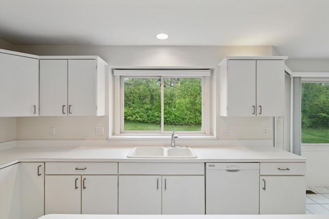 3239 Bellflower Ct, Ann Arbor, MI 48103 - kitchen with dishwasher, a sink, light countertops, and white cabinetry