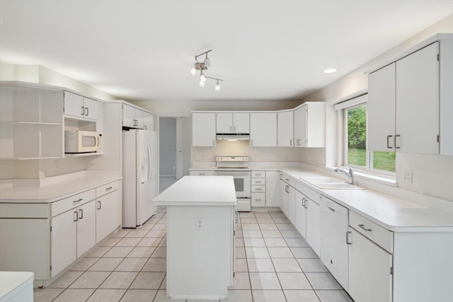 3239 Bellflower Ct, Ann Arbor, MI 48103 - kitchen with white appliances, a sink, a center island, light tile patterned floors, and recessed lighting