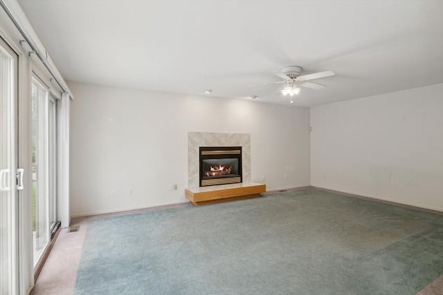 3239 Bellflower Ct, Ann Arbor, MI 48103 - unfurnished living room with light colored carpet, a fireplace, a ceiling fan, and baseboards