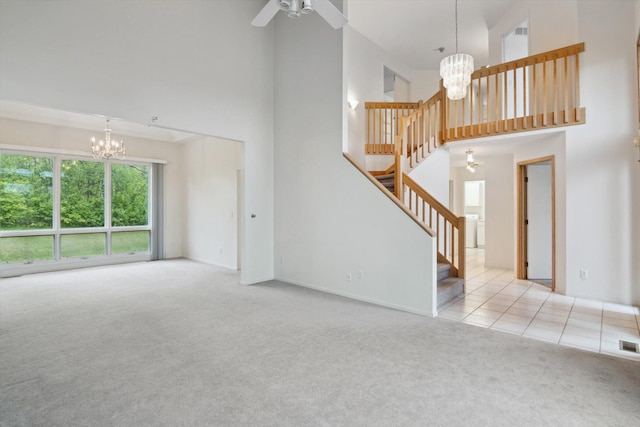 3239 Bellflower Ct, Ann Arbor, MI 48103 - unfurnished living room featuring a chandelier, a high ceiling, carpet, stairway, and a ceiling fan