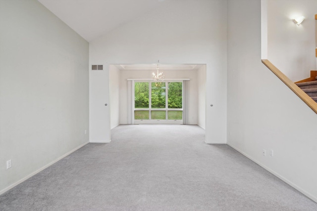 3239 Bellflower Ct, Ann Arbor, MI 48103 - empty room with a chandelier, carpet, high vaulted ceiling, baseboards, and stairs