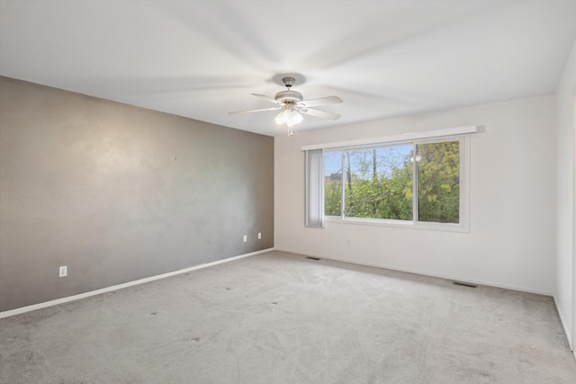 3239 Bellflower Ct, Ann Arbor, MI 48103 - empty room with ceiling fan, carpet flooring, and baseboards