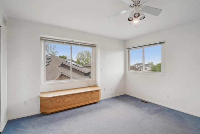 3239 Bellflower Ct, Ann Arbor, MI 48103 - carpeted spare room featuring plenty of natural light, baseboards, and a ceiling fan