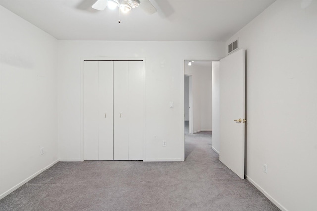 3239 Bellflower Ct, Ann Arbor, MI 48103 - unfurnished bedroom featuring carpet flooring, a closet, baseboards, and a ceiling fan