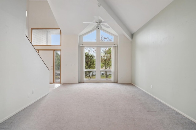 3239 Bellflower Ct, Ann Arbor, MI 48103 - unfurnished living room with a ceiling fan, high vaulted ceiling, light colored carpet, and baseboards