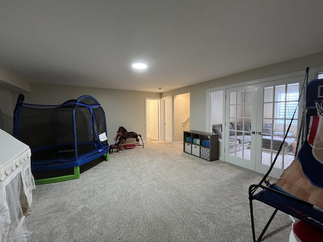 recreation room with french doors, carpet, and recessed lighting