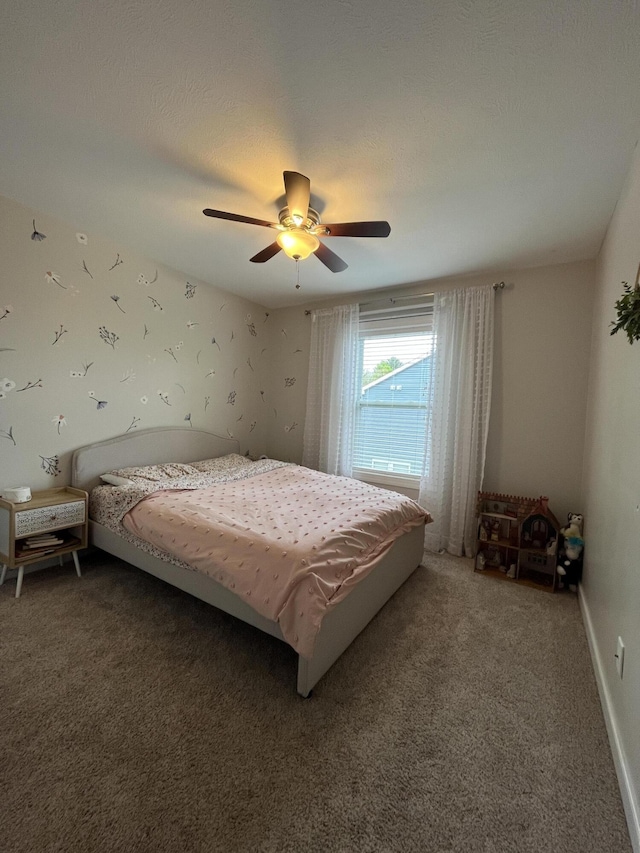 bedroom with light colored carpet, ceiling fan, and baseboards