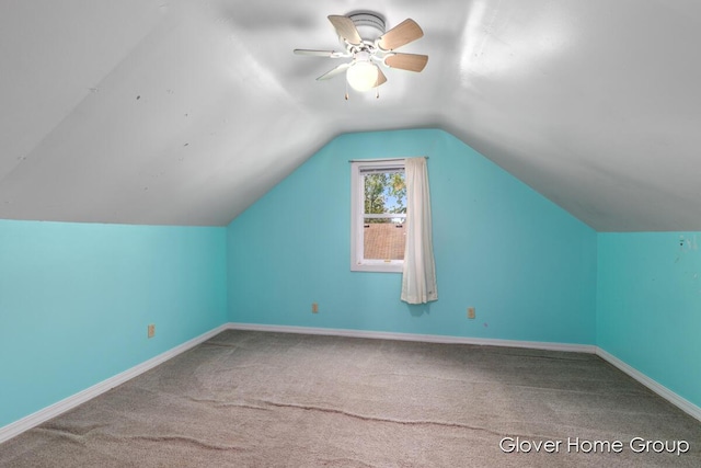 additional living space featuring carpet flooring, ceiling fan, lofted ceiling, and baseboards