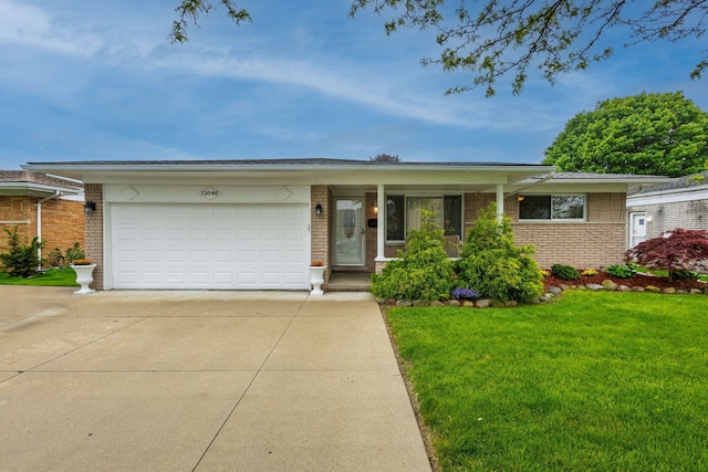 12848 E 14 Mile Rd, Warren, MI 48088 - single story home featuring driveway, brick siding, and a front yard
