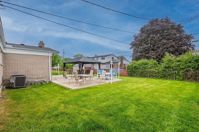 12848 E 14 Mile Rd, Warren, MI 48088 - view of yard featuring a gazebo, central air condition unit, and a patio area