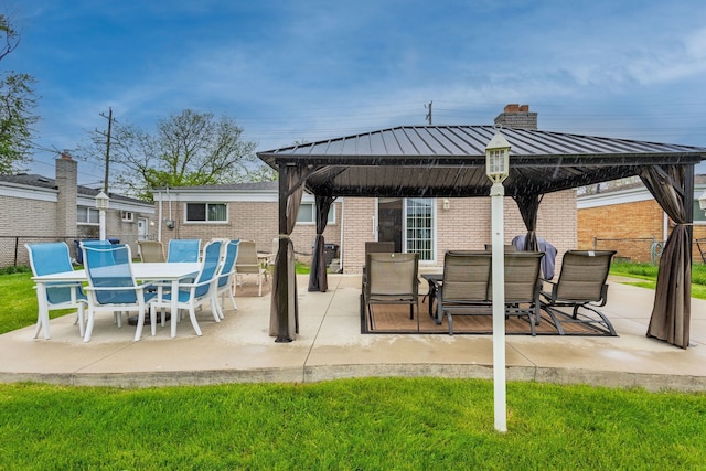 12848 E 14 Mile Rd, Warren, MI 48088 - view of patio with a gazebo, fence, and outdoor dining area