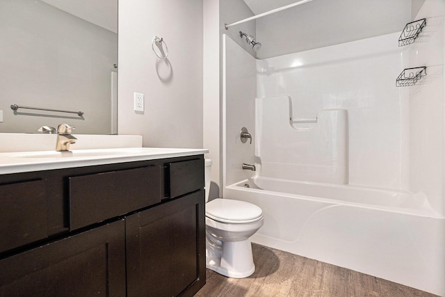 600 Douglas St NW Unit 600C, Grand Rapids, MI 49504 - full bath featuring wood finished floors, toilet, vanity, and shower / bathtub combination