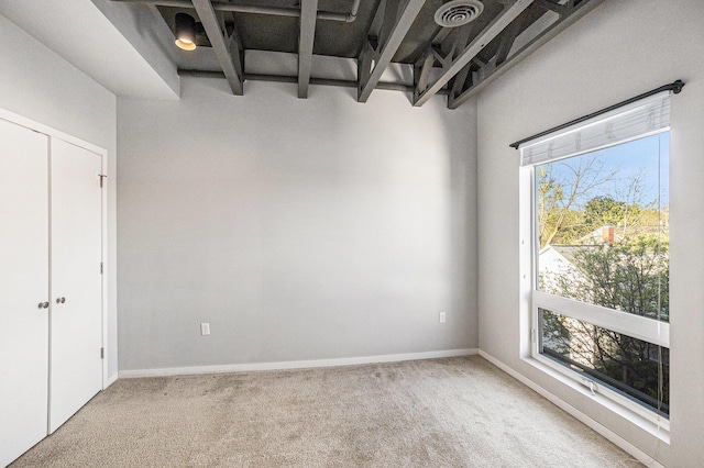 600 Douglas St NW Unit 600C, Grand Rapids, MI 49504 - spare room featuring carpet floors and baseboards