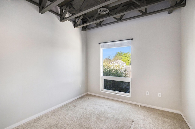 600 Douglas St NW Unit 600C, Grand Rapids, MI 49504 - spare room featuring carpet and baseboards