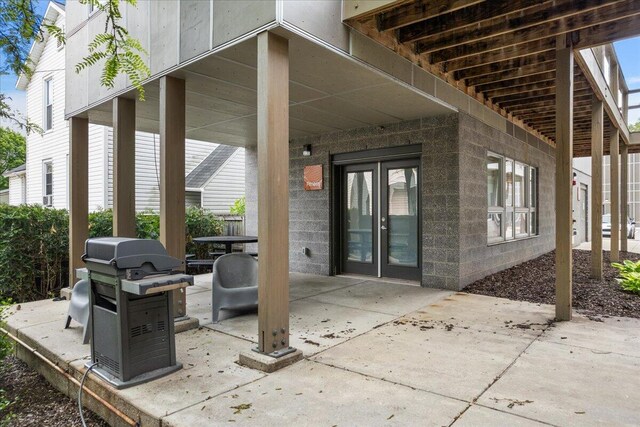 600 Douglas St NW Unit 600C, Grand Rapids, MI 49504 - view of patio with french doors and grilling area