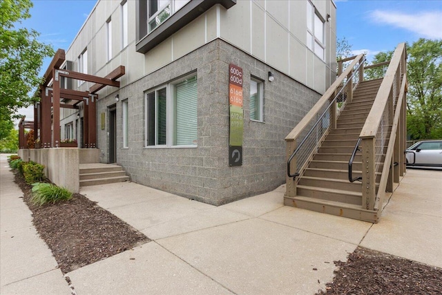 600 Douglas St NW Unit 600C, Grand Rapids, MI 49504 - view of side of property with stairway and concrete block siding