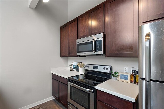 600 Douglas St NW Unit 600C, Grand Rapids, MI 49504 - kitchen featuring stainless steel appliances, dark brown cabinets, and light countertops