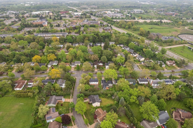 aerial view of property and surrounding area with nearby suburban area