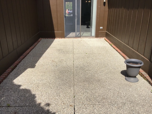 entrance to property featuring a patio area