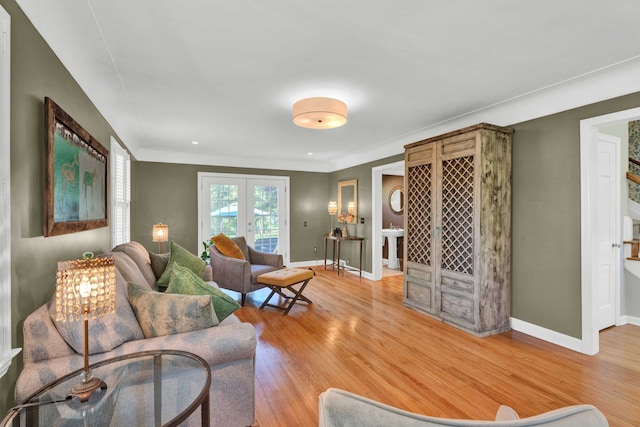 950 W Lincoln St, Birmingham, MI 48009 - living area featuring french doors, light wood-style flooring, and baseboards