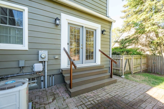 950 W Lincoln St, Birmingham, MI 48009 - view of exterior entry with a patio and cooling unit
