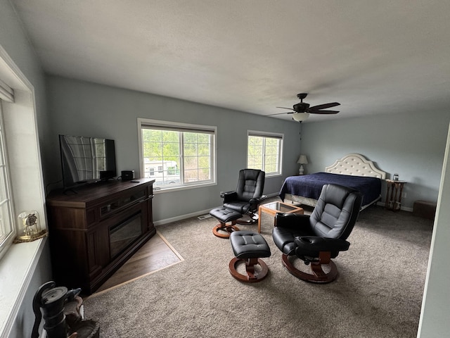 11619 Scott Park Rd, Delton, MI 49046 - sitting room featuring a ceiling fan, carpet flooring, and baseboards