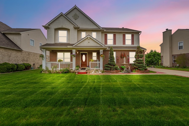 14190 Elmhurst Dr, Sterling Heights, MI 48313 - view of front of house with a porch, a yard, and brick siding