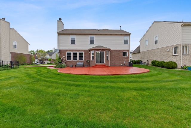 14190 Elmhurst Dr, Sterling Heights, MI 48313 - back of property with a patio, brick siding, a chimney, and entry steps