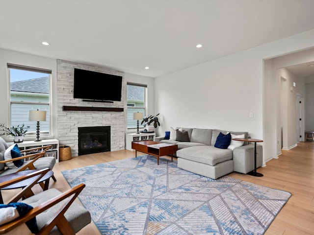4321 Sparrow St, Ann Arbor, MI 48103 - living room with wood finished floors, a fireplace, and recessed lighting